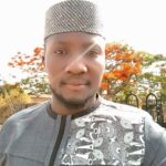 Man in ash coloured nigerian native wear